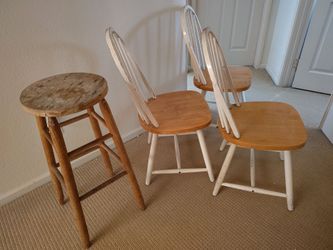 3 wooden chairs and a wooden barstool