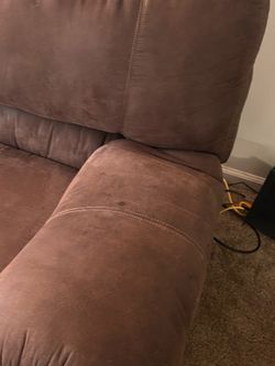 Dark brown, brushed leather sofa and loveseat.