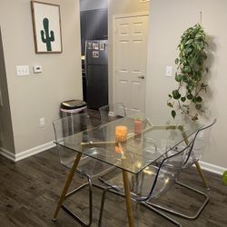 glass table + four acrylic chairs   * open to offers 