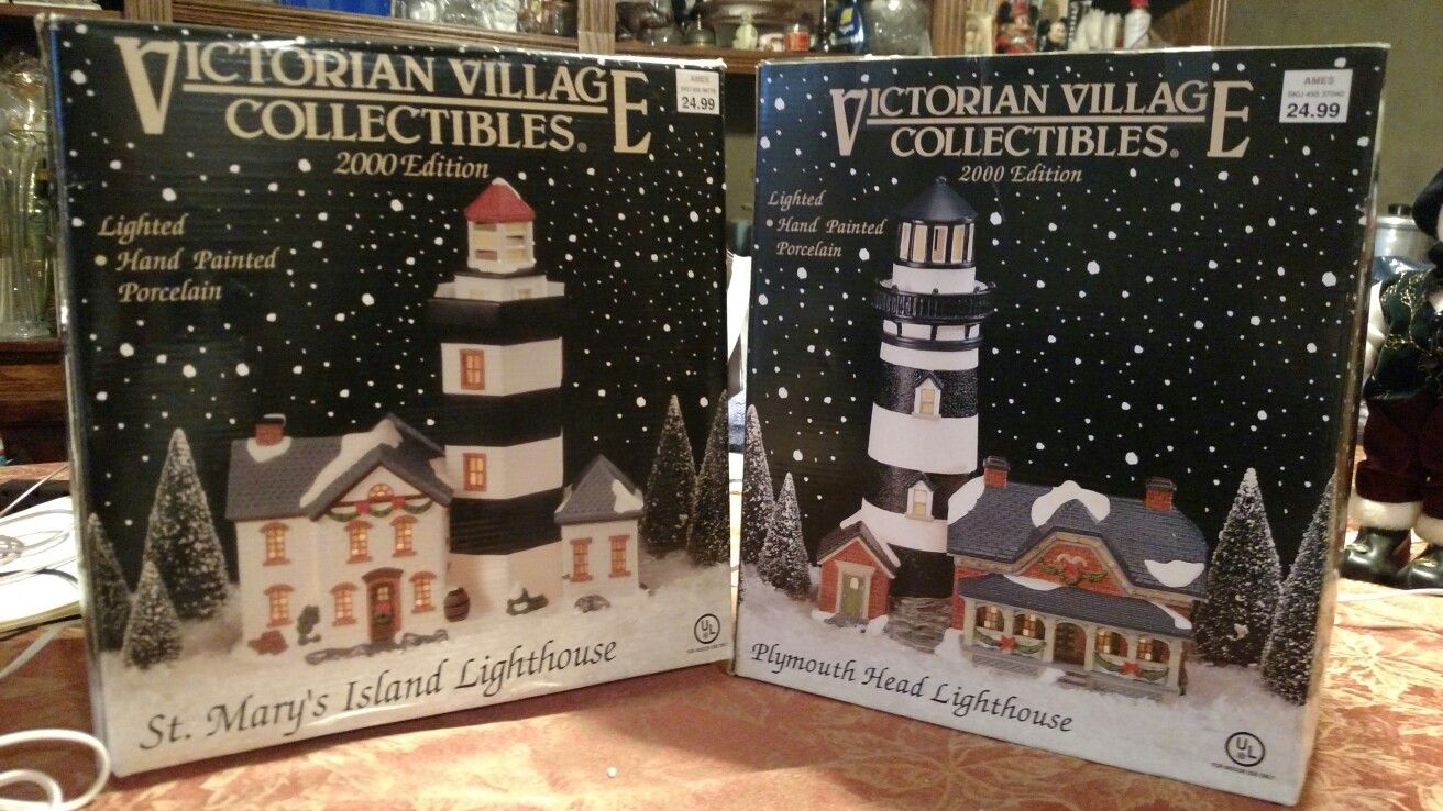 $20.00 for the pair, each are 11" Tall "Victorian Village Lighthouses" 2000 Edition