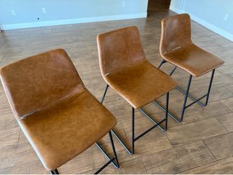 Three tubular metal framed barstool chairs