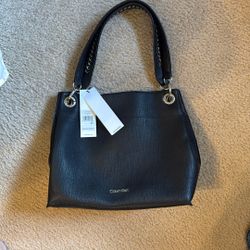 Brand new Calvin Klein Convertible Hand bag with tags never used
