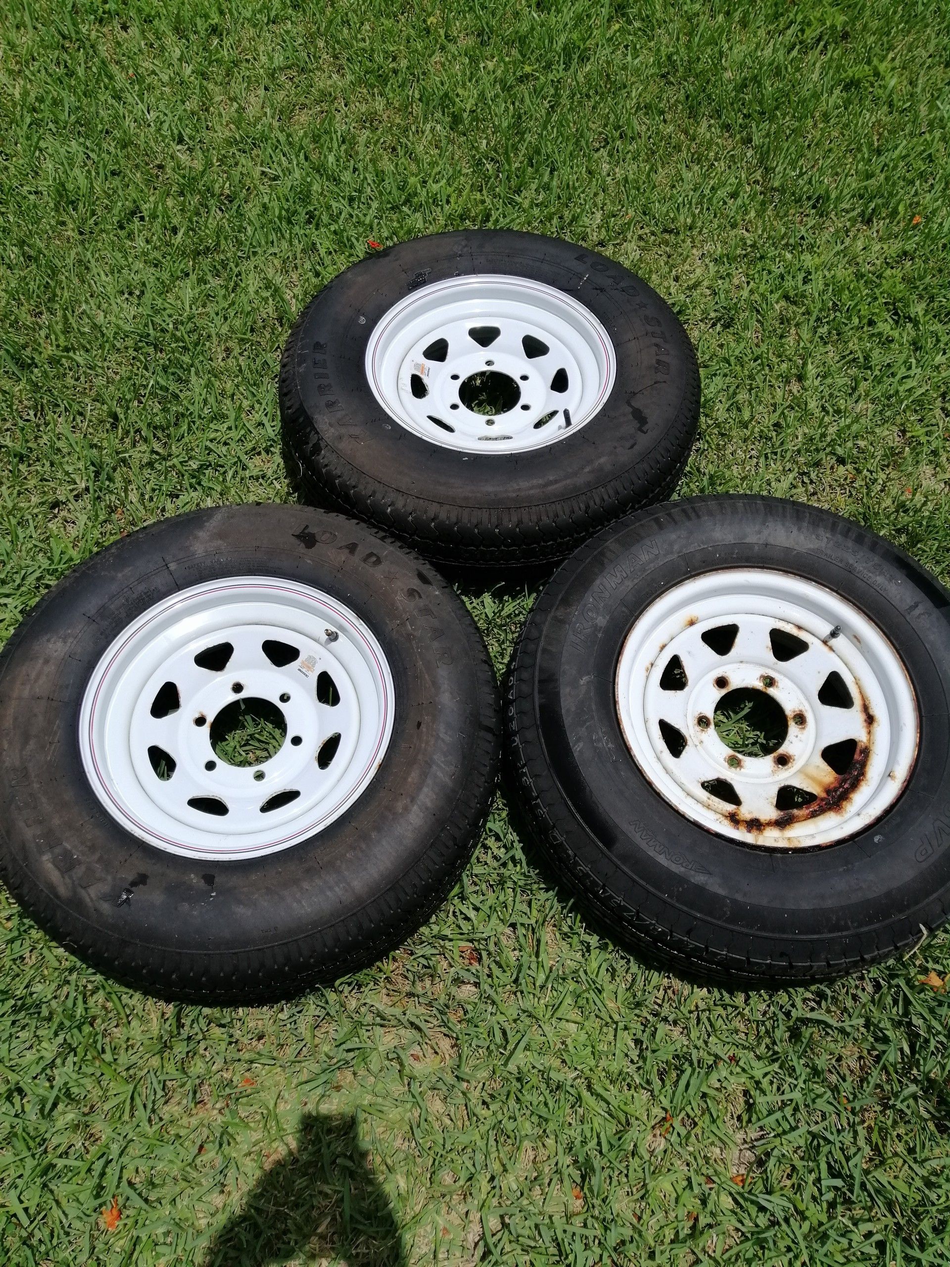 Three 225/75/15 D trailer tires with 6 lug wheels