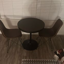 Leather Chairs And Small Table
