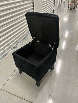 Black suede storage ottoman