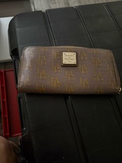 Classic Dooney & Bourke zip-around wallet.