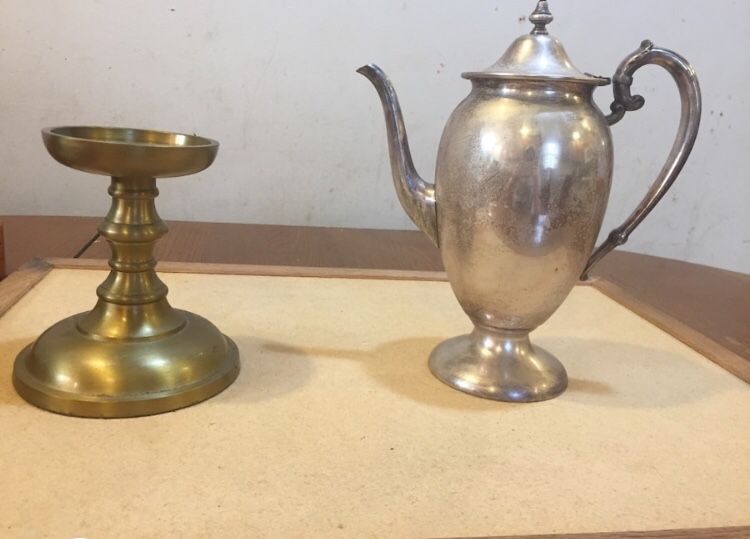 Teapot and brass candle holder