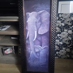 Purple elephant picture in frame.