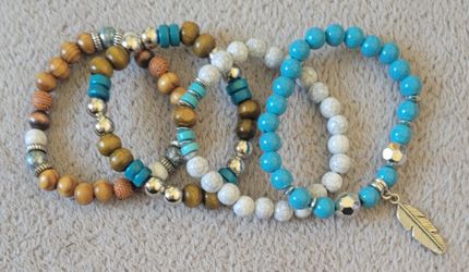 Boho-style stretch bracelets featuring natural wood, white howlite, and turquoise color beads. New. $3 each
