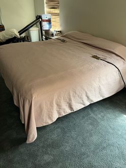 King size Sealy Posturepedic mattress and adjustable steel bed frame. Mattress less than 2 years old. Steel bedframe has dual controls (left side and