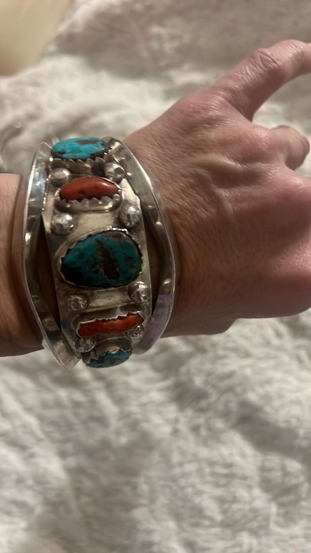 This is a vintage Navajo-made Kingman turquoise and coral sterling silver cuff bracelet