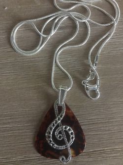 I love music Charm with Guitar Pick on a 30 inch Rope Chain. Silver plated charm and chain. Perfect for the music lover 🎵❤️