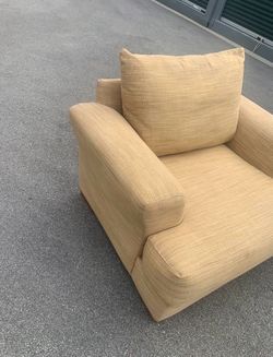 Tan Textured Armchair. oversized chair-and-a-half