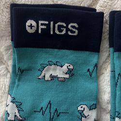 FIGS compression socks, size medium dinosaur logo brand new will sell separately or as a pair