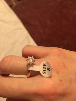 Gold ring with White sapphire center stone