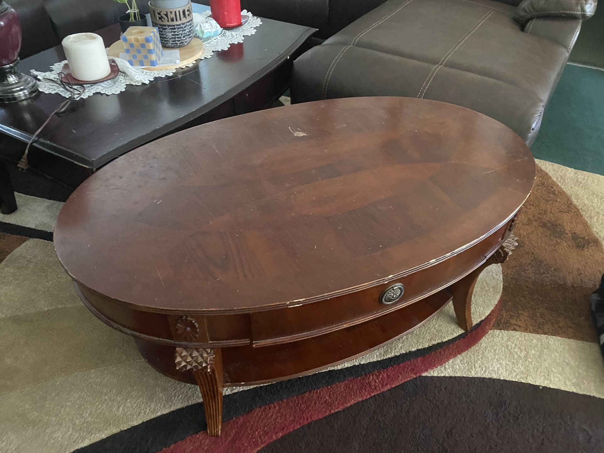 $135-Beautiful  (scratched) coffee table with storage drawer and extra storage shelf underneath  4’ X 2 1/2’ yes it is scratched from use as it is use