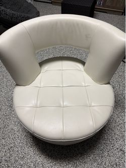 The White Upholstered Barrel Tub Accent Chair is a stylish and comfortable seating option for adults in an indoor setting. The solid white color and u