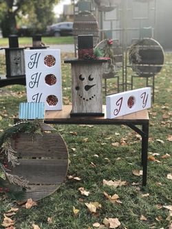 Rustic wooden snowmen and other holiday crafts for gifts