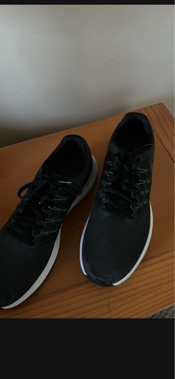 running shoes Black Low-Top Sneakers with White Sole made by Nike  the size is 11 There for Man’s  they are Brand New they’re running shoes