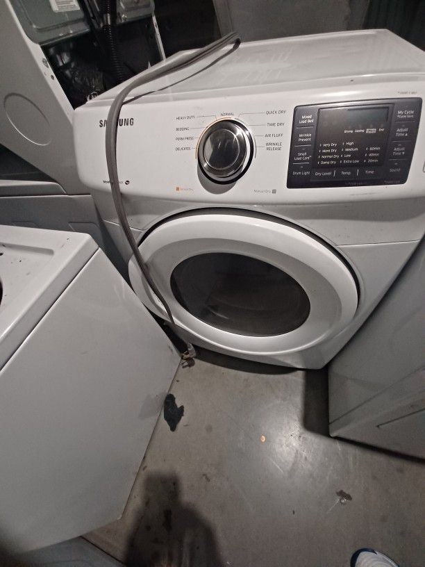 Samsung.
 Heavy duty electric dryer. 1 year warranty works good all new parts.