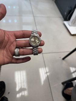 26mm Rolex, fully iced out, featuring diamond bezel