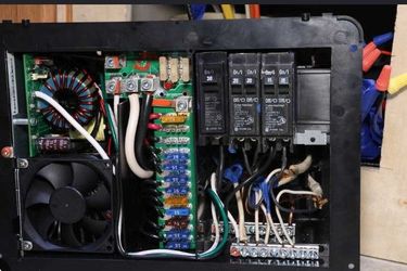 progressive Dynamics 4000 series RV converter and a CDC distribution panel 60 amps with pmw HP2440 solar charge controller 12 v/ 24 v Auto 40amp