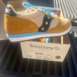 Orange, Tan, And Teal Saucony Shoes 