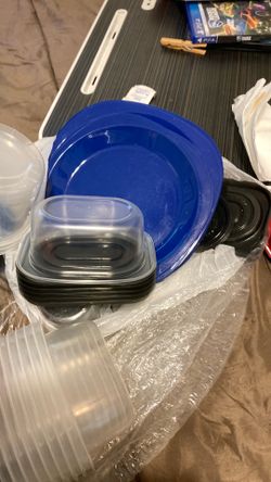 Different sizes of containers with lids several plates