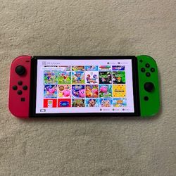 NINTENDO SWITCH OLED with 125 SWITCH GAMES MARIO KART,MARIO PARTY,POKEMON LEGENDS,ZELDA and Many More