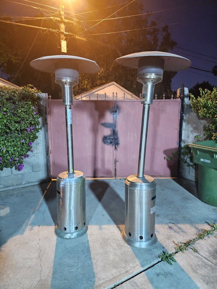 2 PATIO HEATERS STAINLESS STEEL SILVER STILL IN VERY GOOD CONDITION WORKS GREAT YOU CAN TEST IT BEFORE PURCHASE FOR ANY QUESTION TEXT ME PLEASE HABLO 