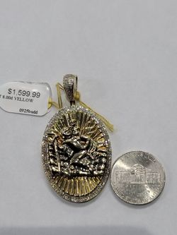 10k gold Saint Christopher charm. 8 penny weights. Inv (846/081/12)