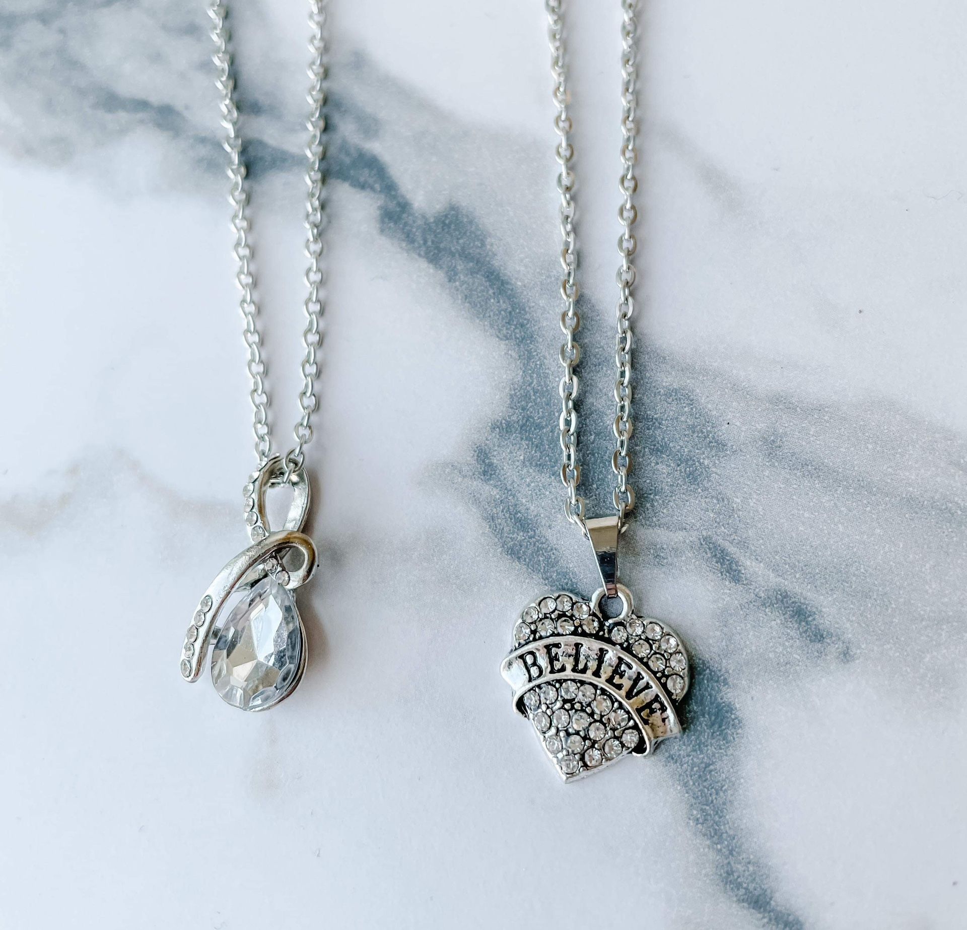 Two silver Tone necklaces with white crystals/faux diamonds