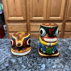 Vintage 1960’s Indian Totem Pole Porcelain Pair of Salt And Pepper Shakers.  With original Cork stoppers.  Preowned never used.  