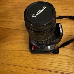Canon Rebel Xsi - a Lowepro bag, 50mm lens plus a UV FILTER