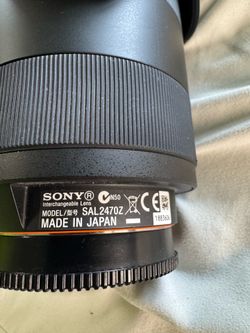 Professional-grade Sony SAL2470Z interchangeable lens with a black finish.