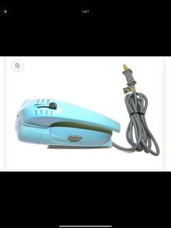 This is a vintage Sunbeam Mixmaster Junior hand mixer, likely produced between 1955 and 1965.  Here's some information about it: Function: It was desi