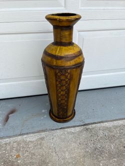 Large metal vase in good condition and attractive; it measures 26 inches in height and 7 inches in width at the top.
