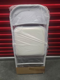 White padded folding chair