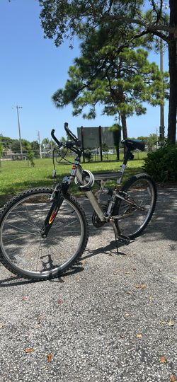 PACIFIC 26” Dual-suspension mountain bike (featuring both a front suspension fork and a rear frame shock absorber).