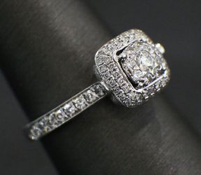18K White Gold Diamond Engagement Ring containing a .24ct Round Brilliant Cut Center Diamond Surrounded by .26ctw in Round Brilliant Cut Diamonds