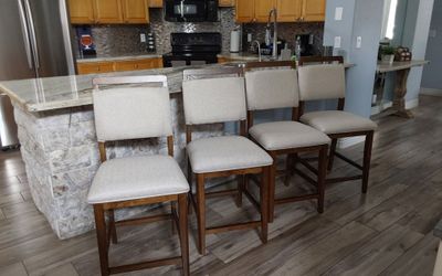 Four beautiful mid-century counter height bar stools