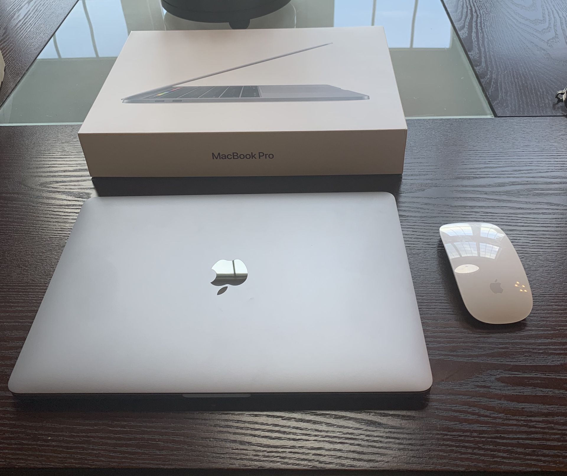 2019 MacBook Pro with Touch Bar and Apple wireless mouse for sale