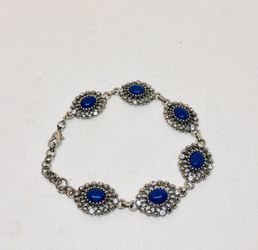 Silver tone bracelet with blue stones and rhinestones