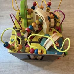 This is a B. toys Zany Zoo wooden activity cube