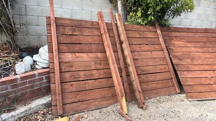 Redwood fencing, two of them approximately 10 feet across