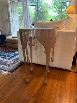 Surreal metal and glass end table