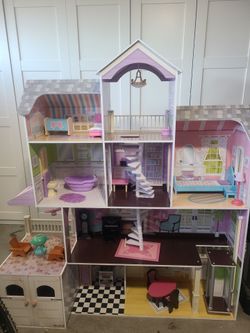 A dall play house with furniture