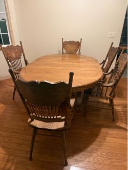 Solid oak dining table with 6 armchairs