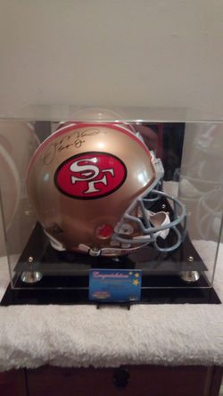 One of ONE authentic hand sighed inscribed "" super Joe""" Joe Montana riddle pro line helmet in mirrored display case with C.O.A