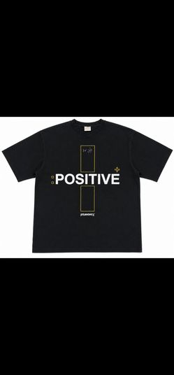Men’s black graphic T-shirt featuring a bold “POSITIVE” front print with additional motivational text and design details. Classic short-sleeve crew-ne